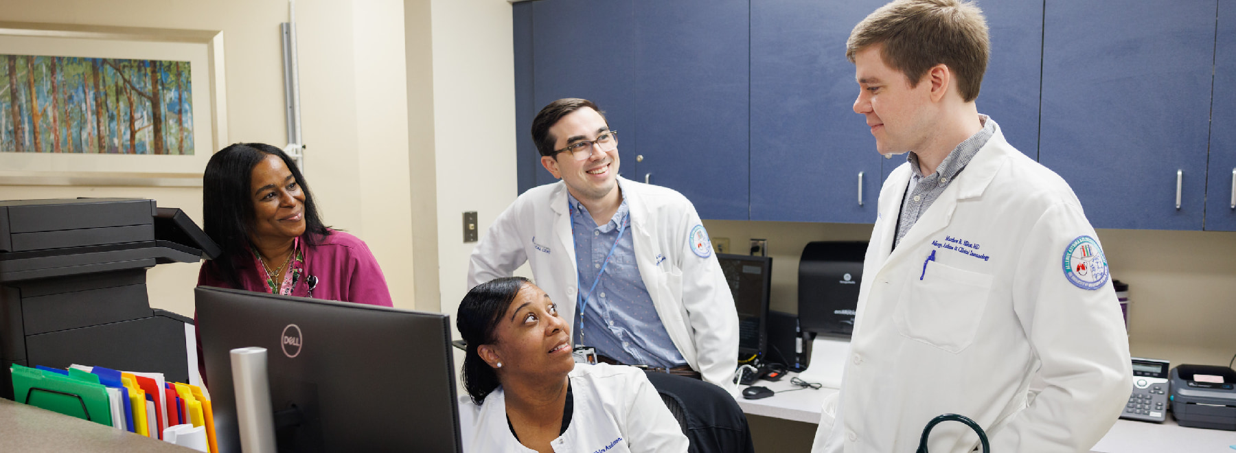 A group of providers interacting in the Allergy Clinic